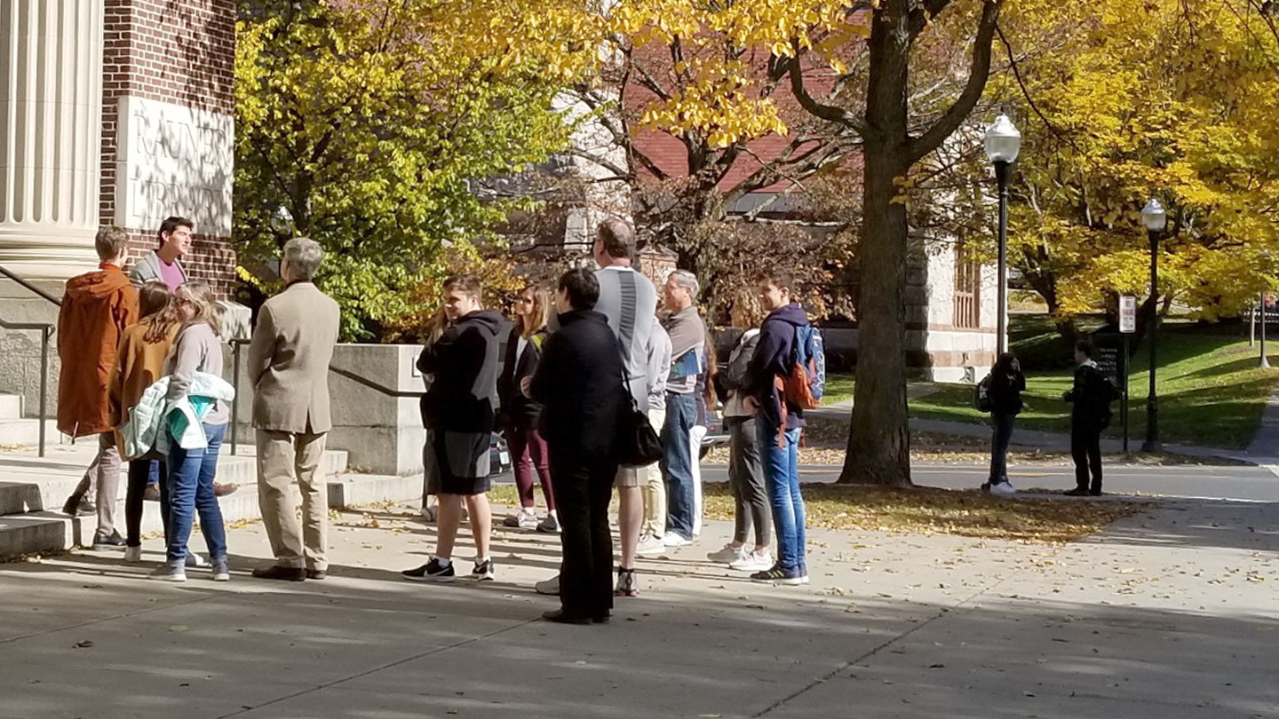 A photo of a group taking a campus tour in the fall