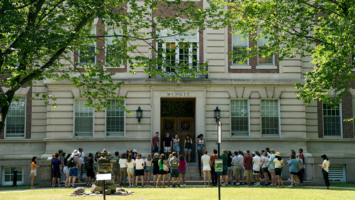 A photo of students and families in front of McNutt Hall with tour guides on the steps