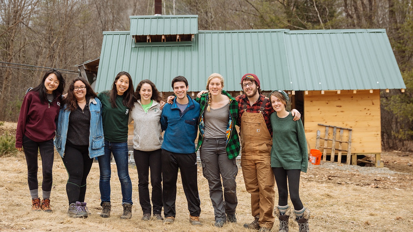 Photo of students in front of the Organic Farm's maple sugar house