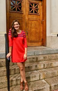 Adina in orange dress McNutt stairs