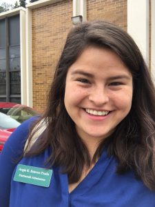 Selfie of a young woman with dark hair and a Dartmouth admissions nametag