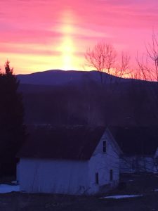 sunset over farmhouse