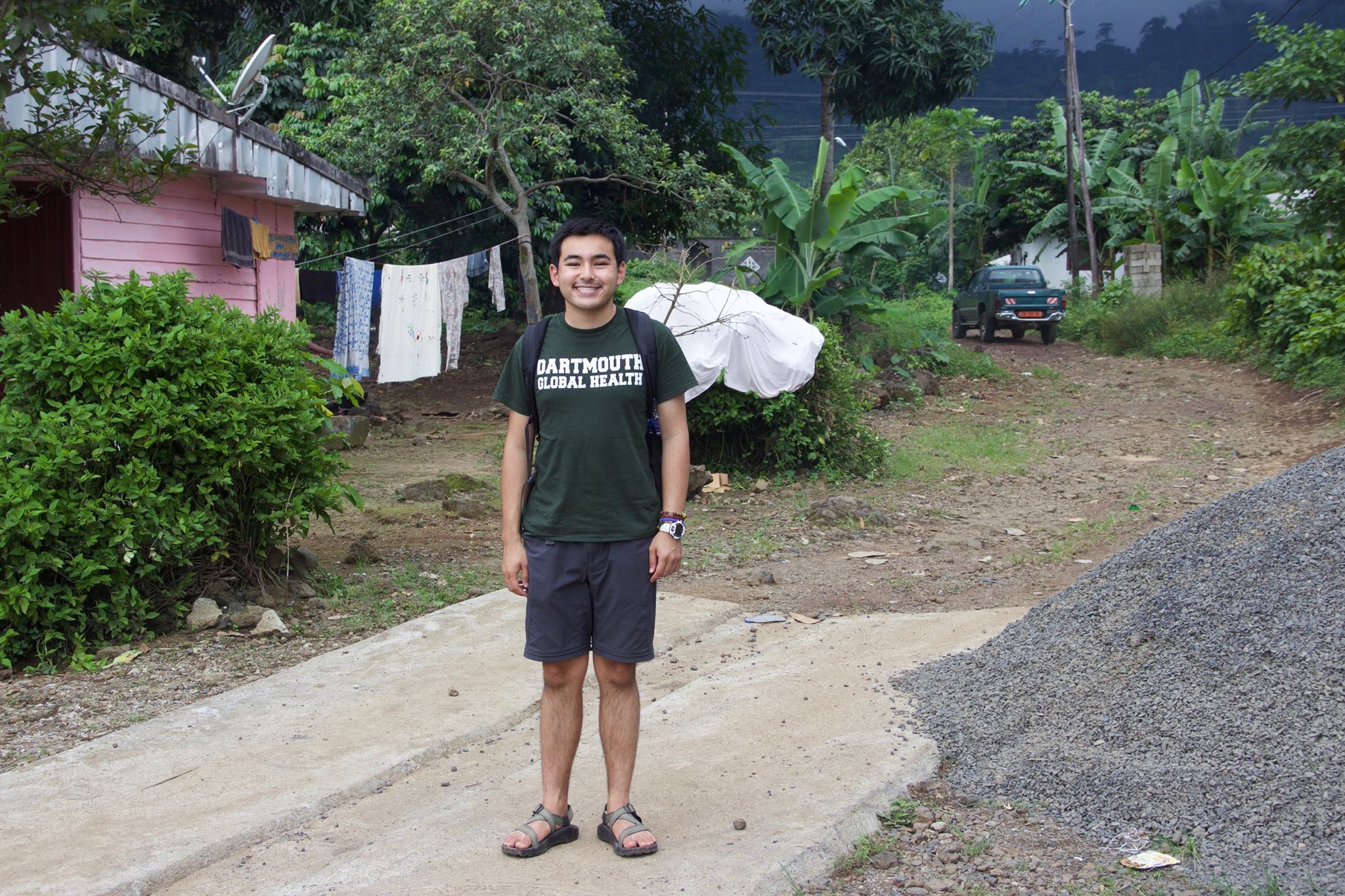 Dartmouth student in street of Cameroon village