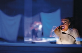 A photo of a student working tech on the production of Pippin