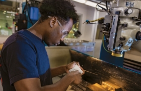 A photo of Rashad Brown Mitchell '24, a teaching assitant at the Machine Shop