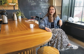 A photo of Armita Mirkarimi '25 sitting in The Nest 