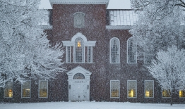 A photo of Berry-Baker Library with snow falling