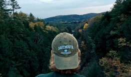 A photo of a student in a baseball hat