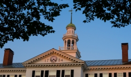 A photo of the top of Dartmouth Hall in twilight