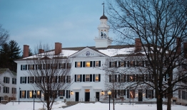 A photo of Dartmouth Hall in winter with snow on the ground