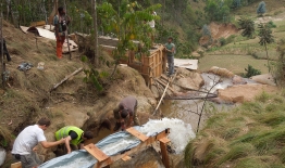 A photo of students working on hydropower in Rwanda