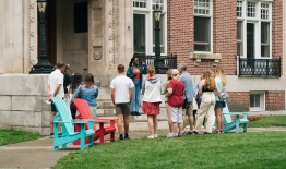 A photo of a campus tour on the steps of Robinson Hall.