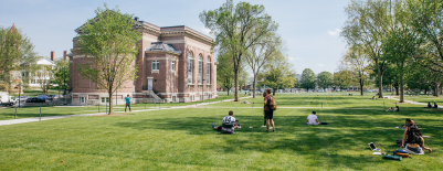A photo of students on the Baker Library lawn