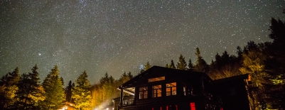 Image of Moosilauke Ravine Lodge at night under a stary sky
