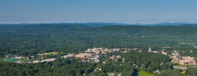 A photo of campus with Green Mountains and Killington in the background