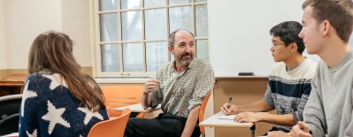A photo of professor Michael Herron in the classroom with students