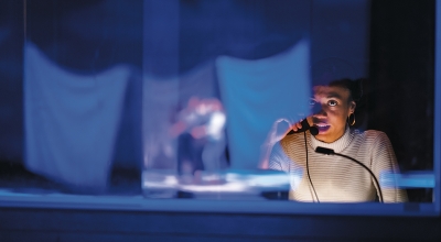 A photo of a student working tech on the production of Pippin
