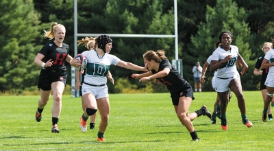 A photo of Dartmouth's Woman's Rugby team playing Harvard