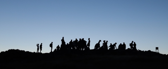 People silhouetted on the summit of Moosilauke