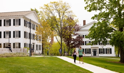 A photo of students on a walkway in front of Dartmouth Hall in September