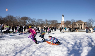 A photo of students participating in the Human Dogsled Race during the 2023 Winter Carnival