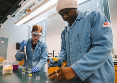 A photo of two students working in a chemistry lab