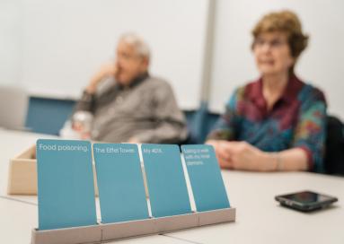 A photo of cards sitting in front of an elderly couple