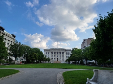 A big white stone building: Harvard School of Public Health from afar. 