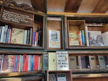 Word on Water Bookstore: Books on wooden shelves.