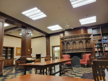 Sherman Art Library: Wooden interior, desks, and bookshelves with books