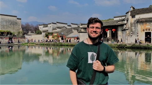 Gui in front of a manmade lake in Anhui province, China