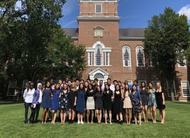 students posing in front of Baker Berry Library