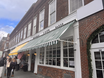 Brick building/ Lou's Storefront, decoratared using green and white stripes