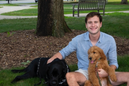 Blog author sitting with two dogs
