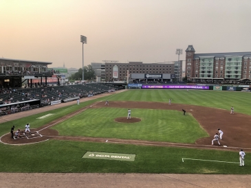 A baseball park in the evening