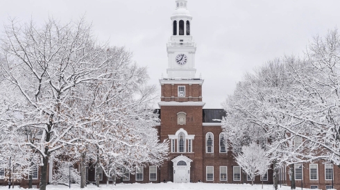 the view of a snow-covered Baker Library at Dartmouth College during the winter