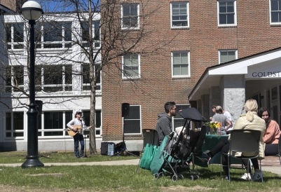 a photo of a concert happening on the lawn outside a residential building at Dartmouth