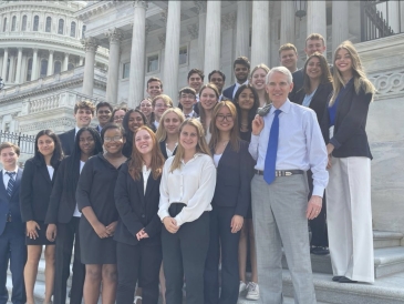 First-Year Fellows and Senator Rob Portman on the steps of Capitol Hill