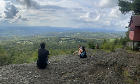Gabriel Gilbert's friends sitting on Wright Mountain, VT