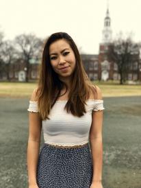 Portrait shot of female student on the campus green