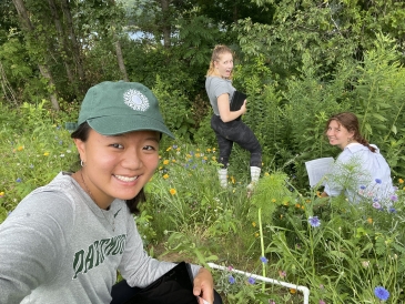 A selfie with my Agroecology class groupmates as we count the number of specific flower types in the Organic Farm.