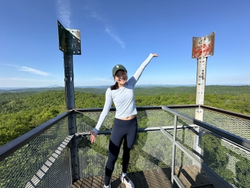 A horizontal picture of me from the top of the Gile Mountain fire tower observation area, a popular beginner-friendly hike near campus.