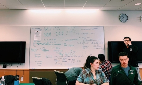Biology class! a white board with student's scratchwork on the wall of a clasroom