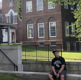 Gabe Gilbert as a Prospective Student in front of Baker Library