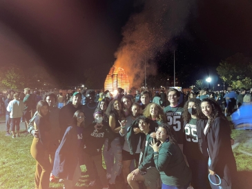 The Brazilian class of 2025 in front of the bonfire