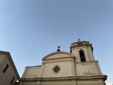 Crotone's main Catholic church, the Roman Catholic Archdiocese of Crotone-Santa Severina, against a clear blue sky. 