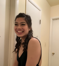 Diana smiling for a photo before a school formal