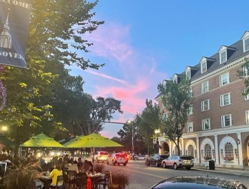 A picture of a pink sky in Hanover on a busy street.