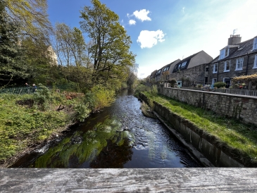 an image of a small river through Edinburgh