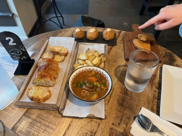 Spanish small plates: bread, meatballs, potatoes. 